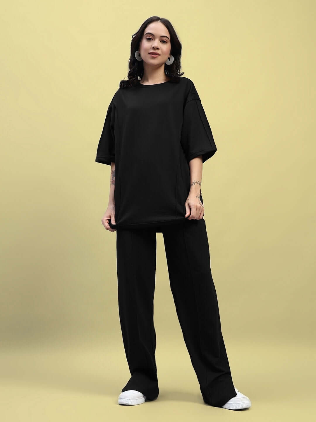 Model wearing Women's Zion Relaxed Fit Co-Ord Set in black, featuring a comfortable t-shirt and joggers with elasticated waistband.