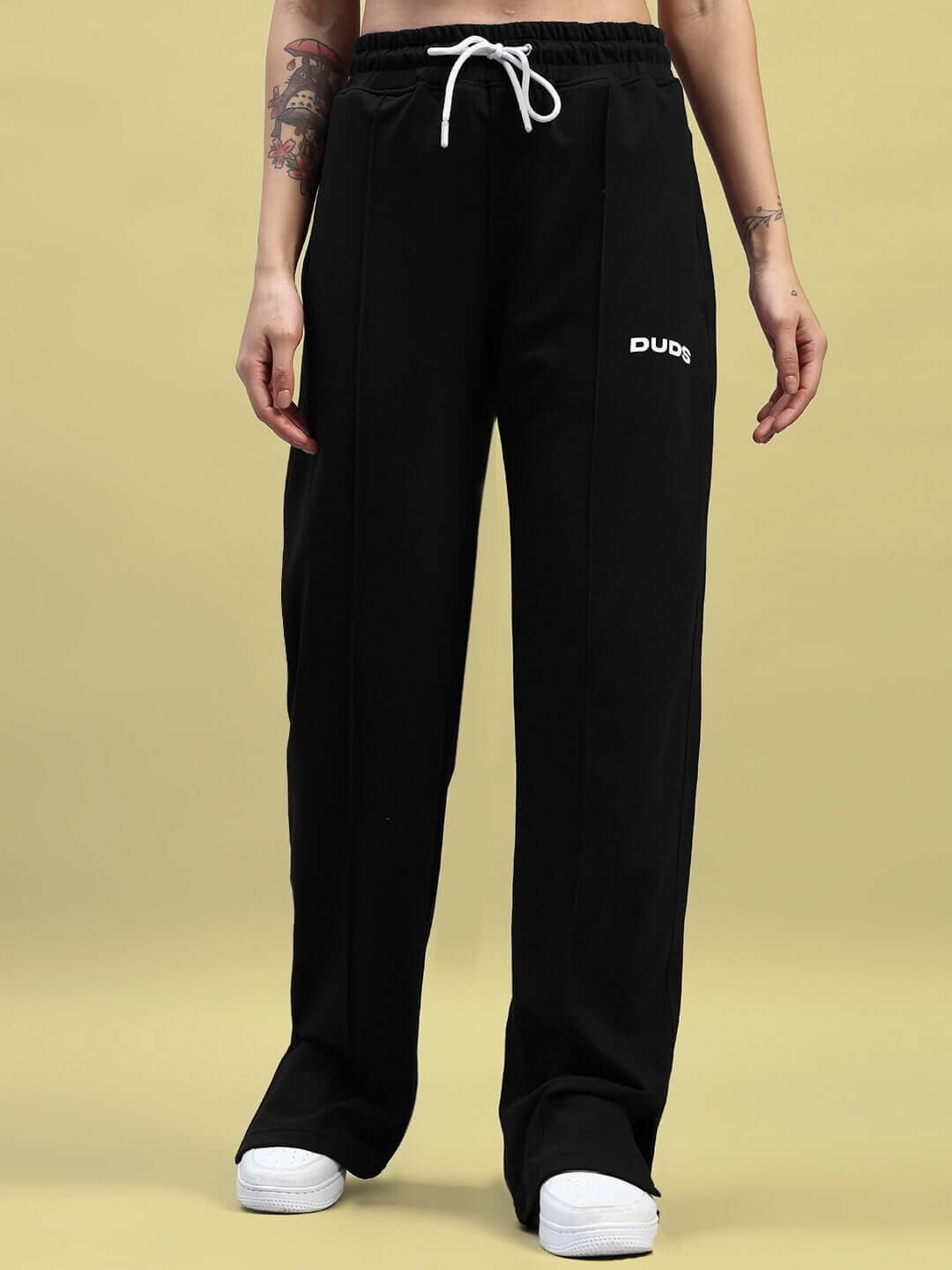 Black relaxed fit joggers with elasticated waistband and drawstring, featuring premium cotton material for comfort and style.