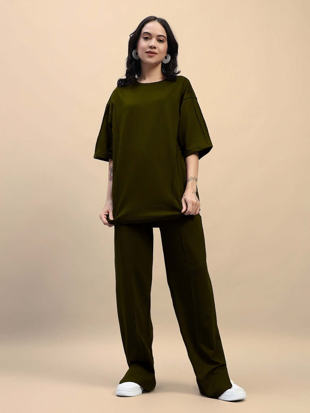 Model wearing olive green women's Zion relaxed fit co-ord set with joggers and oversized t-shirt.