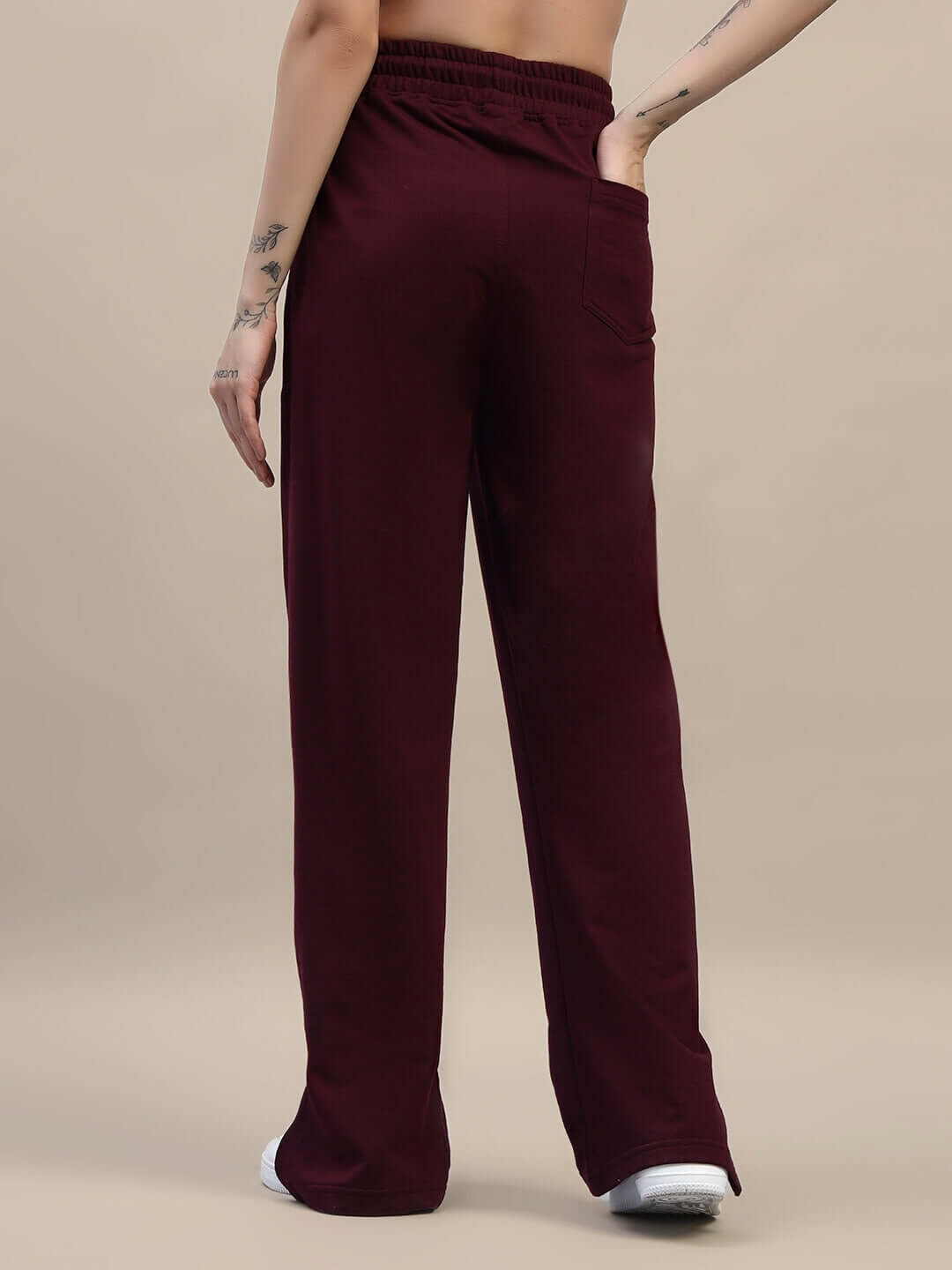 Back view of WOMEN'S ZION SIDE SLIT JOGGERS MAROON highlighting relaxed fit and side slit design.