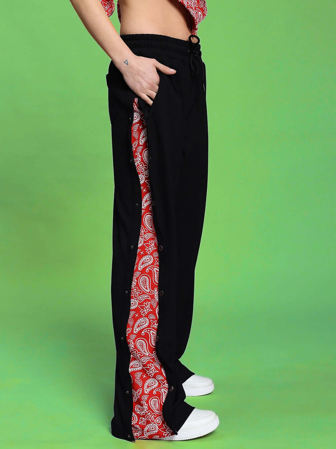 Model showcasing the stylish WOMEN'S ZIVA CO-ORD SET RED-BLACK with red paisley detail, highlighting modern design and comfort.