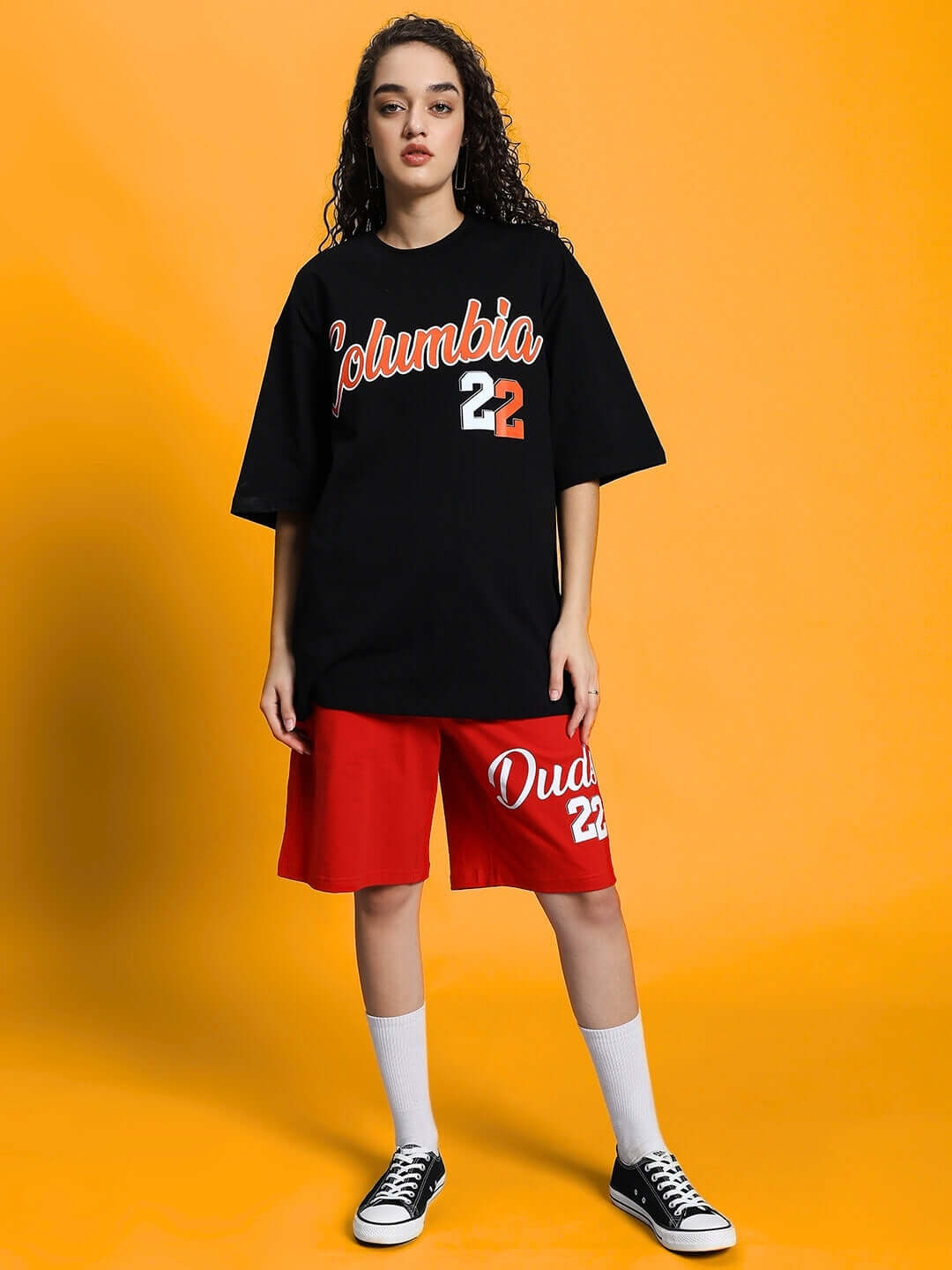 Model wearing WOMEN'S COLUMBIA 22 PRINT SUMMER CO-ORD SET BLACK RED with bold streetwear design and comfortable fabric.