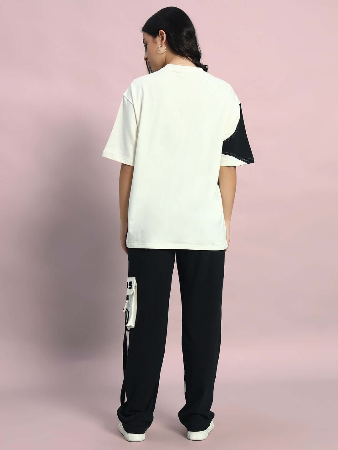 Back view of model wearing oversized off white-black David co-ord set with joggers, featuring elastic waistband and premium cotton fabric.