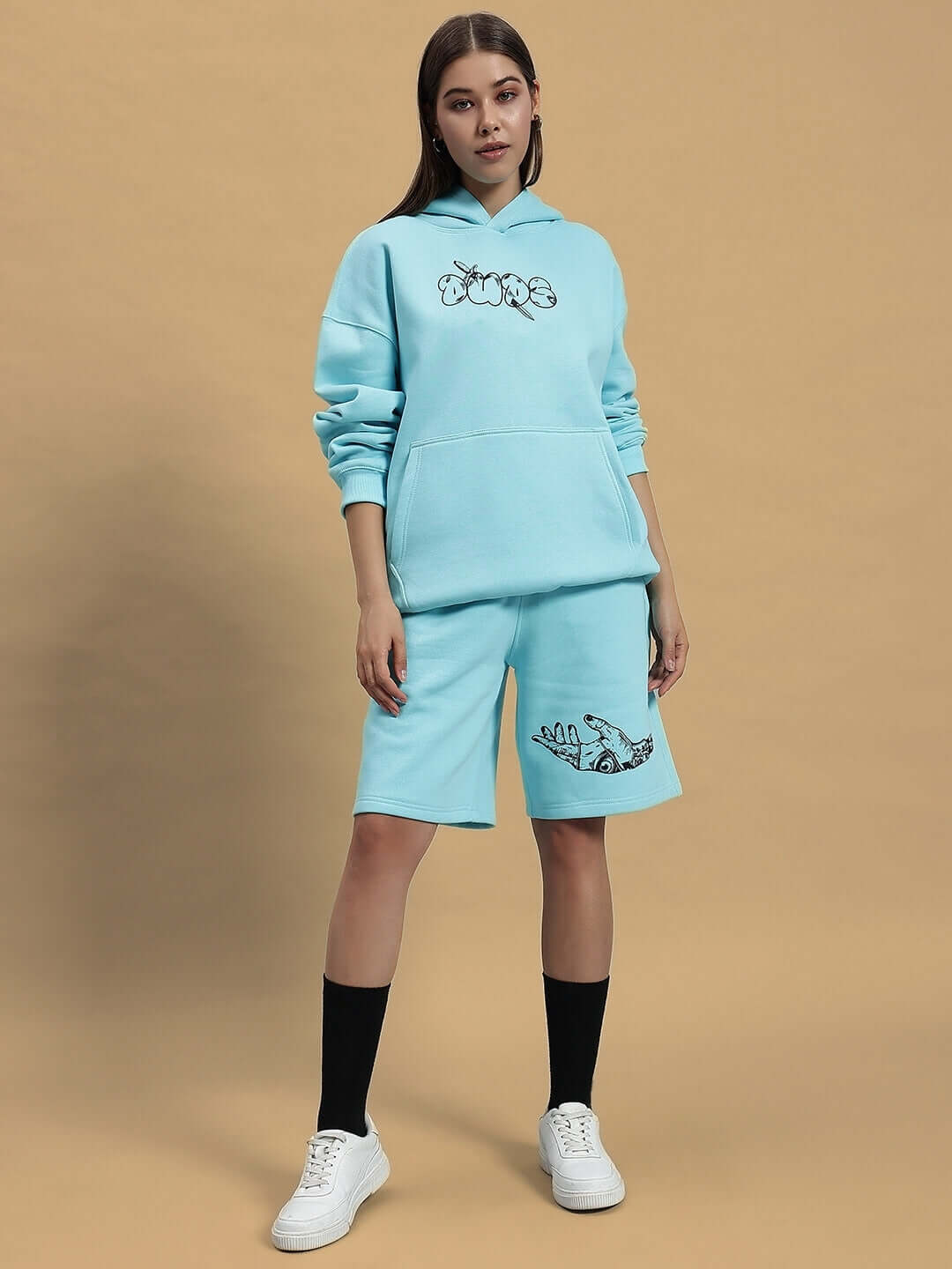 Model wearing WOMEN DEMON FLEECE CO-ORD SKY BLUE with hoodie and shorts, showcasing relaxed fit and casual style.