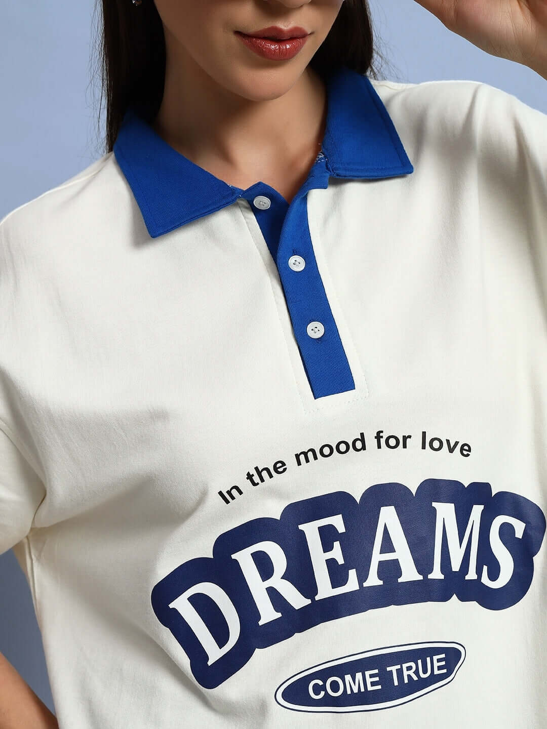 Women's Love Dreams Oversized Sweatshirt, off-white with royal blue collar, featuring "Dreams Come True" text, made from cotton terry.