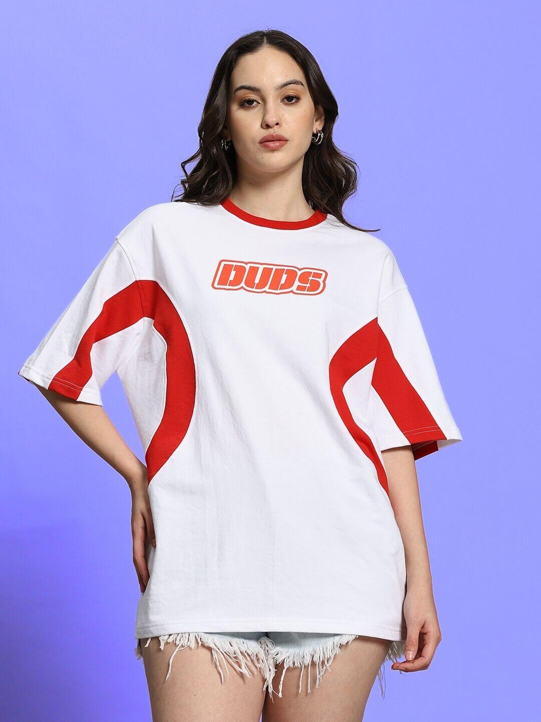 Model wearing women's oversized white-red Ezel T-shirt with DUDS logo, crafted from premium cotton blend, featuring red accents.