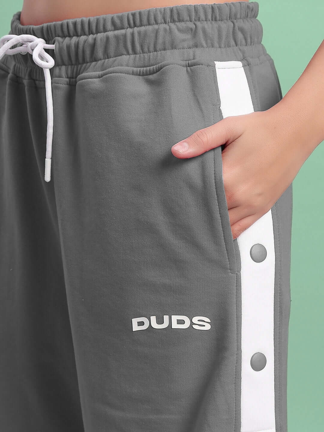 Close-up of Women's Ezel Regular Fit Grey Shorts by DUDS with button detailing and waistband.