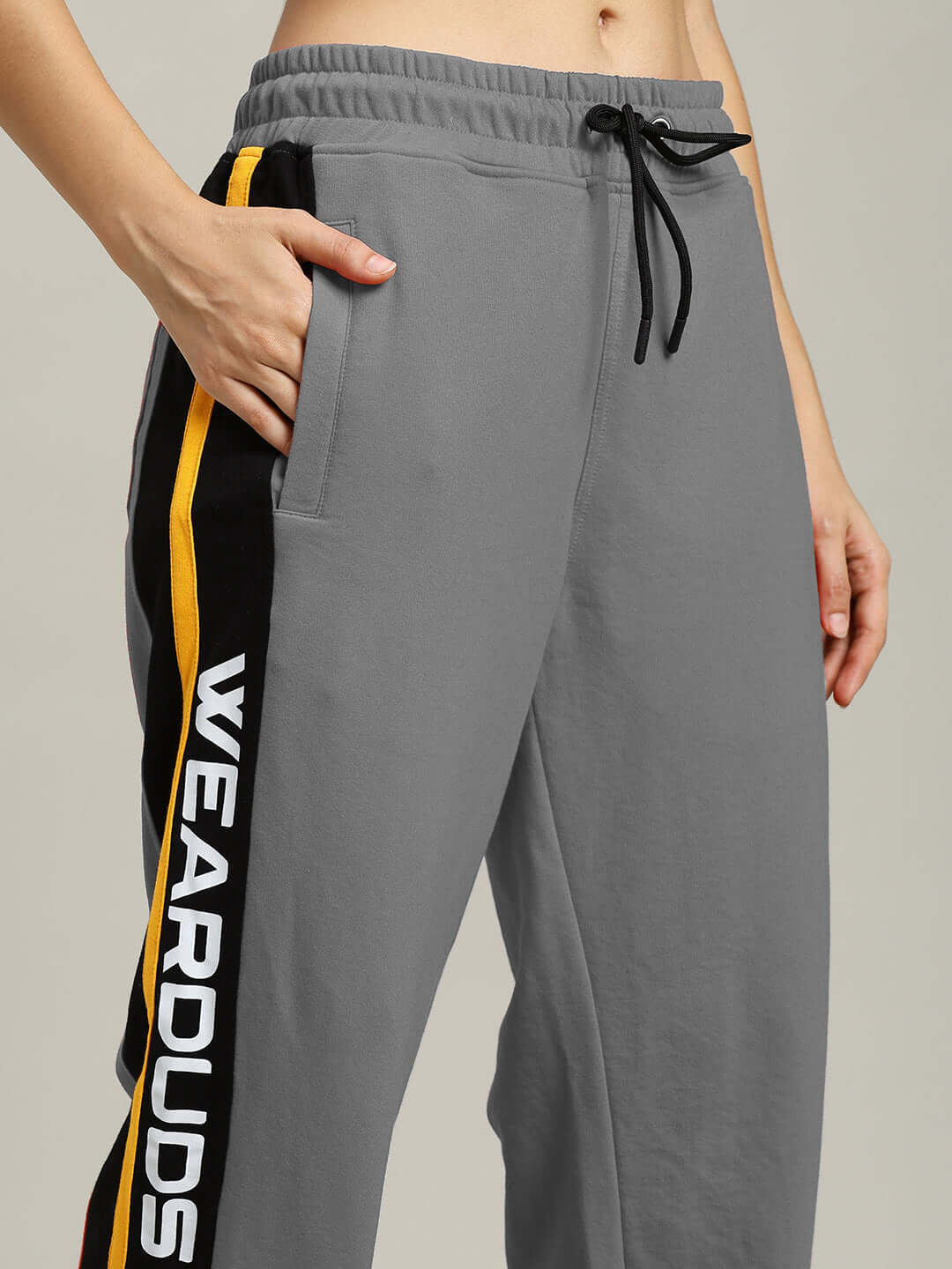 Women's relaxed-fit grey joggers by DUDS with side stripe detail, customizable size options available.