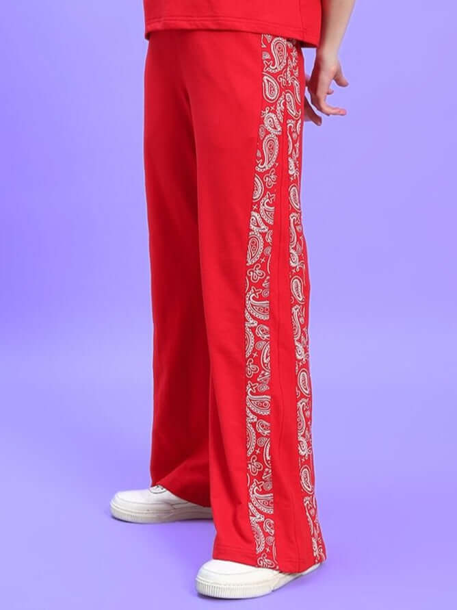 Red women's joggers with paisley side stripe, relaxed fit from DUDS, ideal for casual wear and customizable for perfect fit.