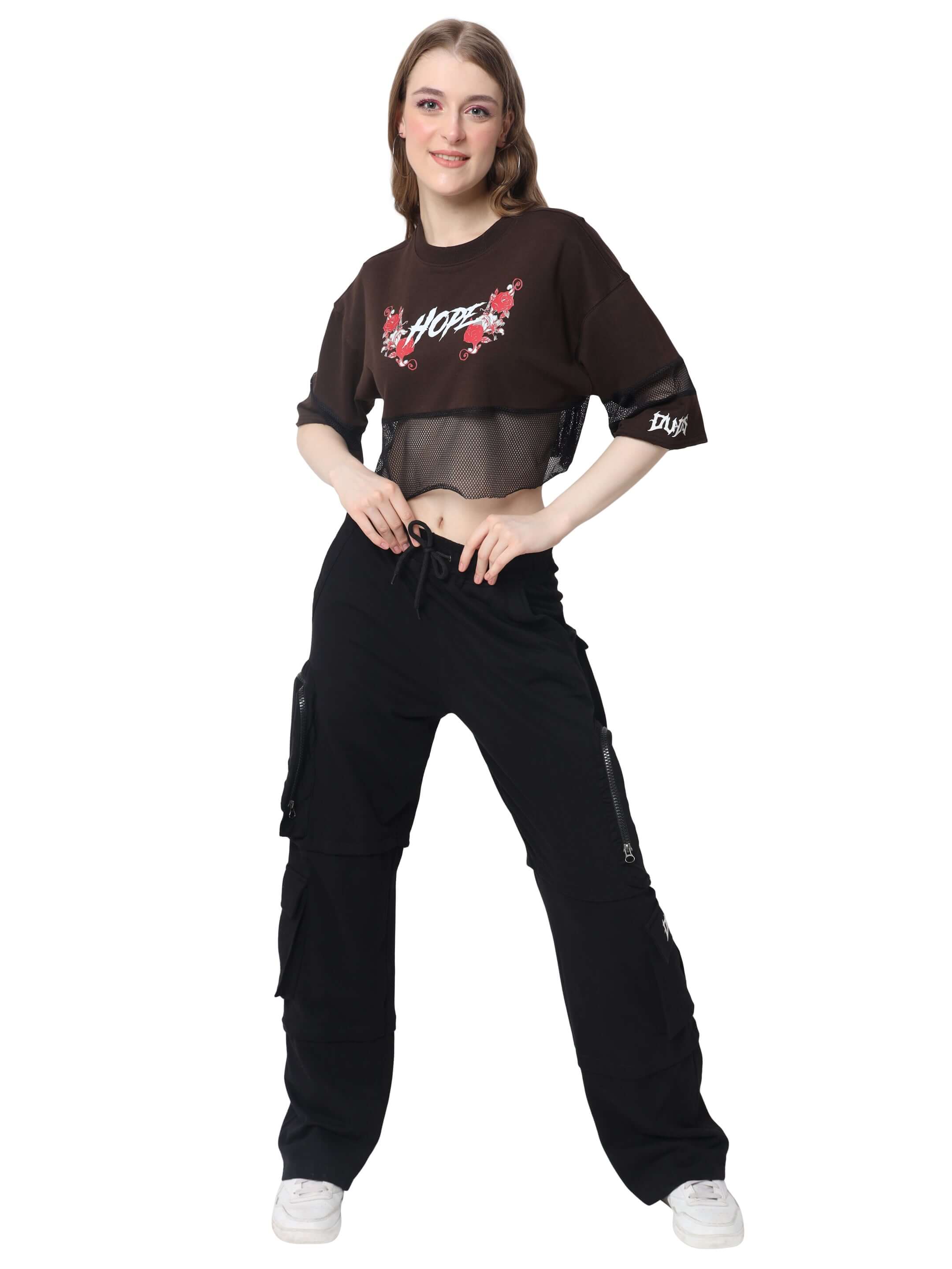Model wearing brown oversized cropped t-shirt with 'Hope' print and black cargo pants, showcasing casual streetwear fashion.