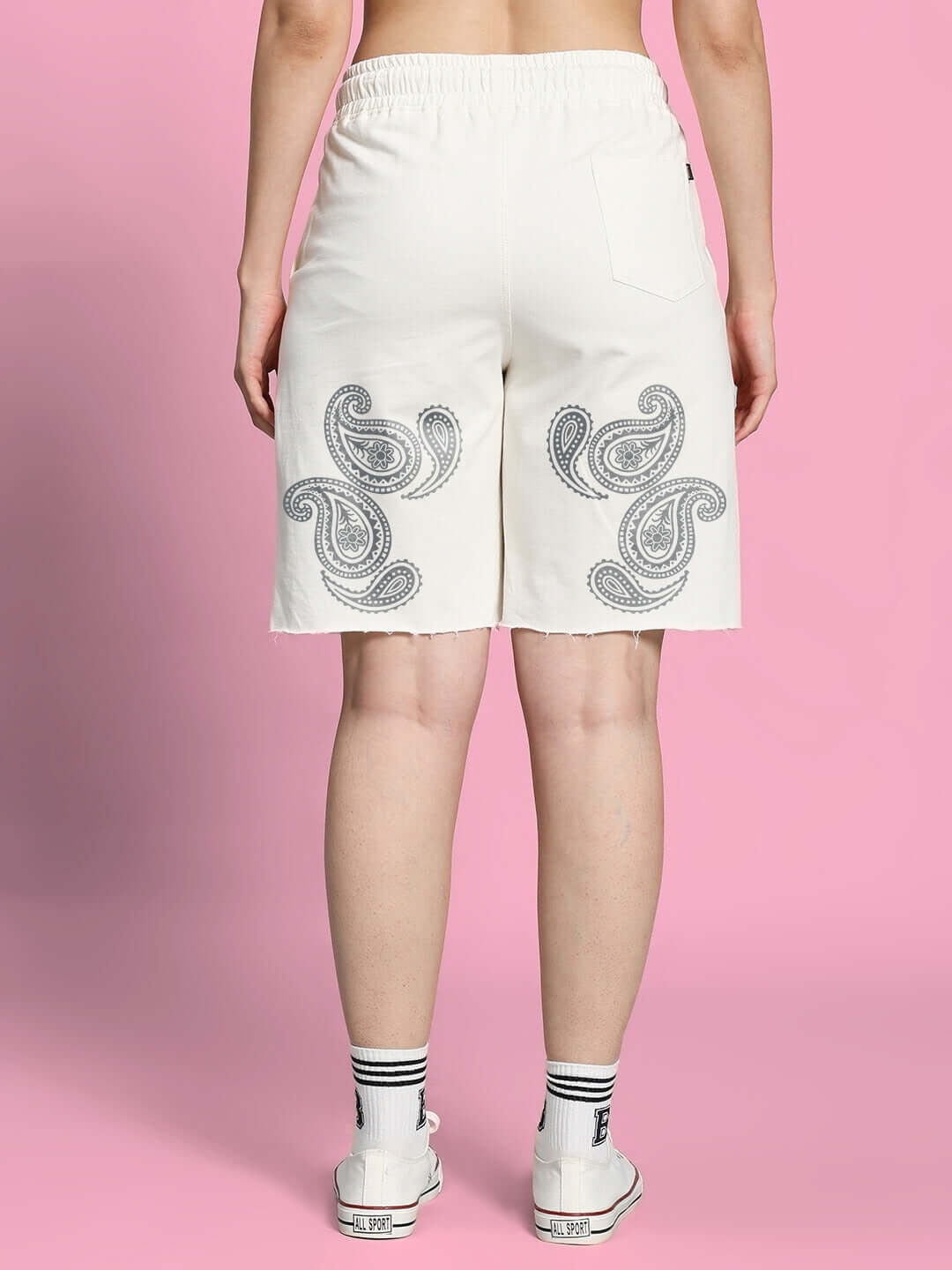 Back view of Women's Messi Paisley Print Co-Ord Set Off White shorts with paisley design on a pink background.
