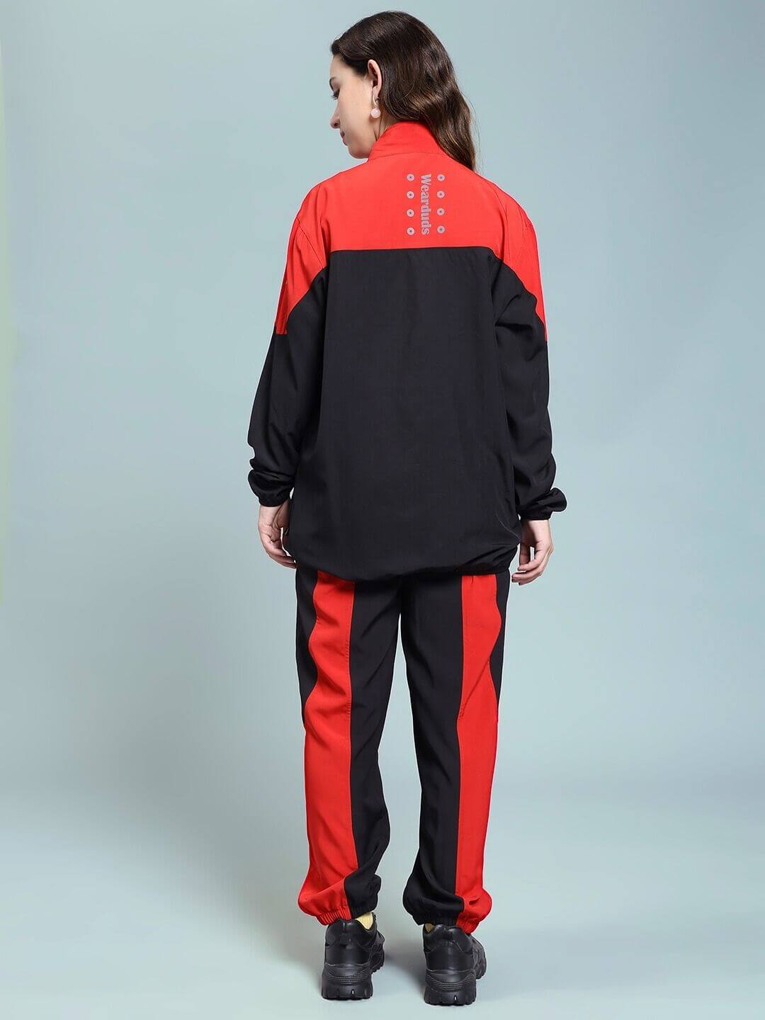 Back view of WOMEN POWER BLOCK CO-ORD SET BLACK RED featuring striking color block design.
