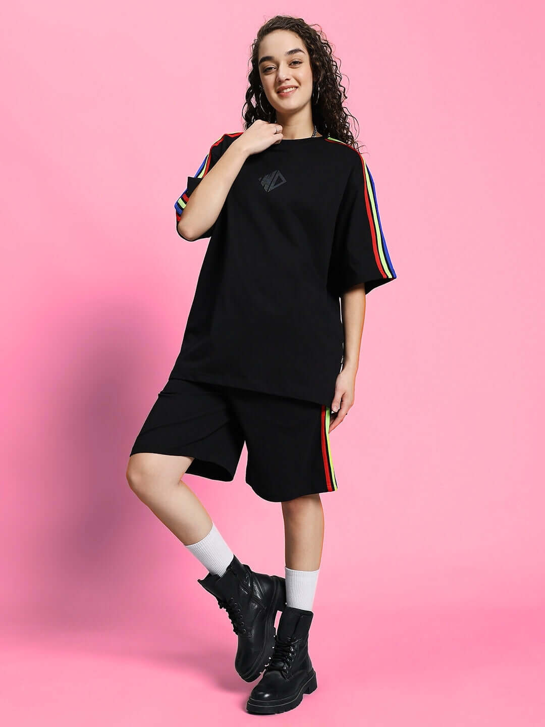 Model wearing WOMEN'S RAINBOW SUMMER CO-ORD SET BLACK with rainbow detailing, styled for a casual summer look.