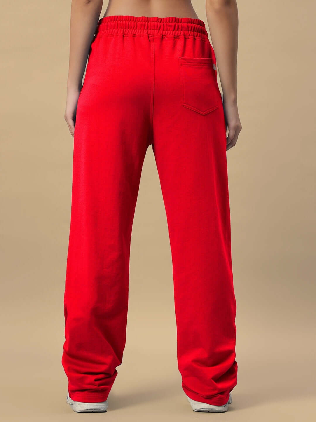 Back view of red women's Hershey side slit joggers made by DUDS, featuring comfortable fit and pocket detail.