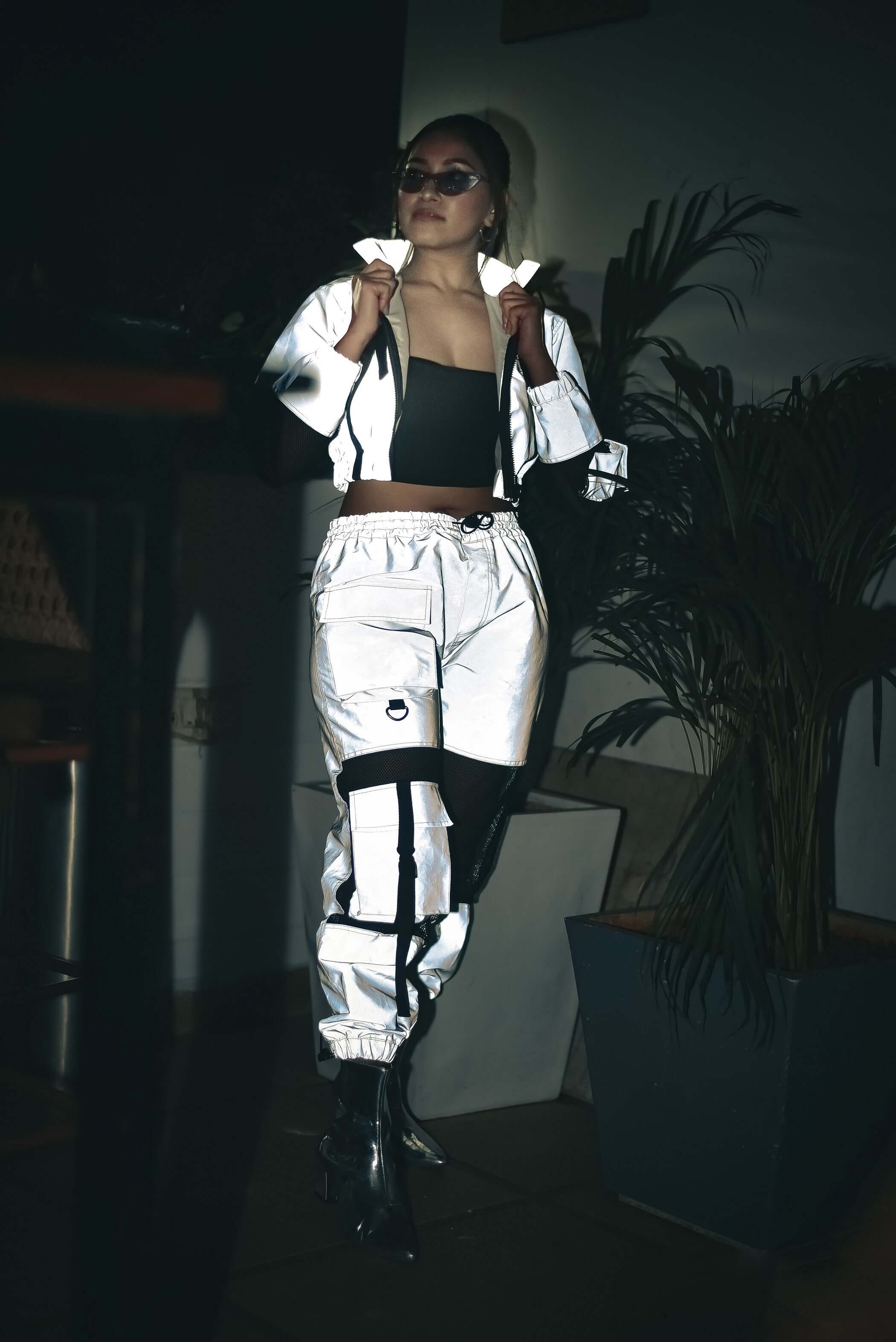 Model wearing WOMEN'S REFLECTOR CO-ORD SET CARGO PANTS WITH JACKET showcasing edgy street style fashion.