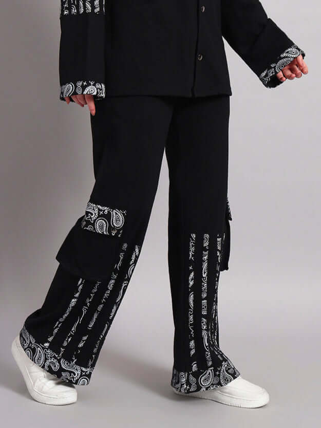 Black Sanganeri joggers for women with white paisley pattern, made by DUDS, featuring custom fit option for perfect sizing.