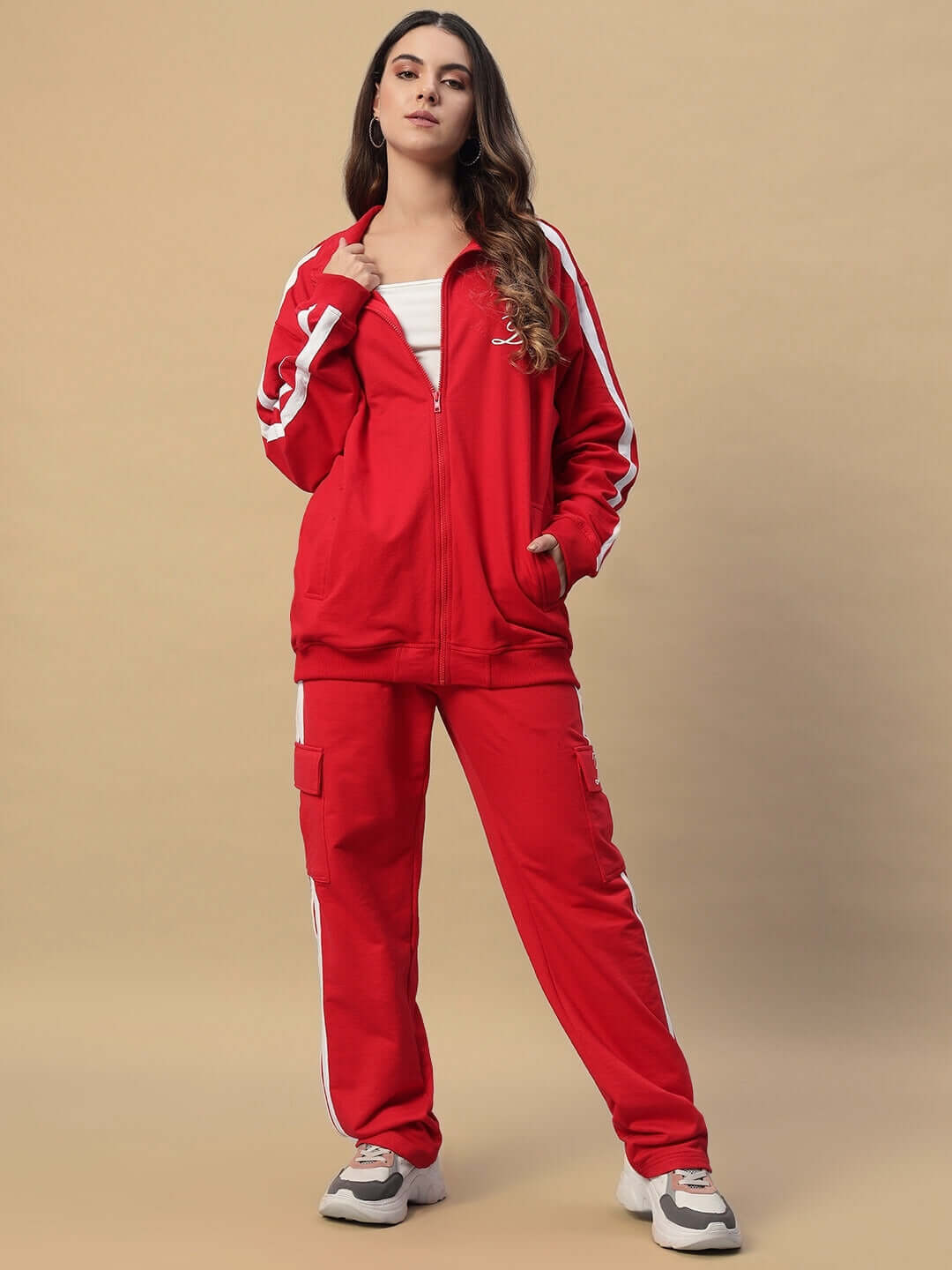 Model wearing WOMEN'S SCOTIA STRIPE JOGGERS in red by DUDS, featuring a stylish stripe design, perfect for casual wear.