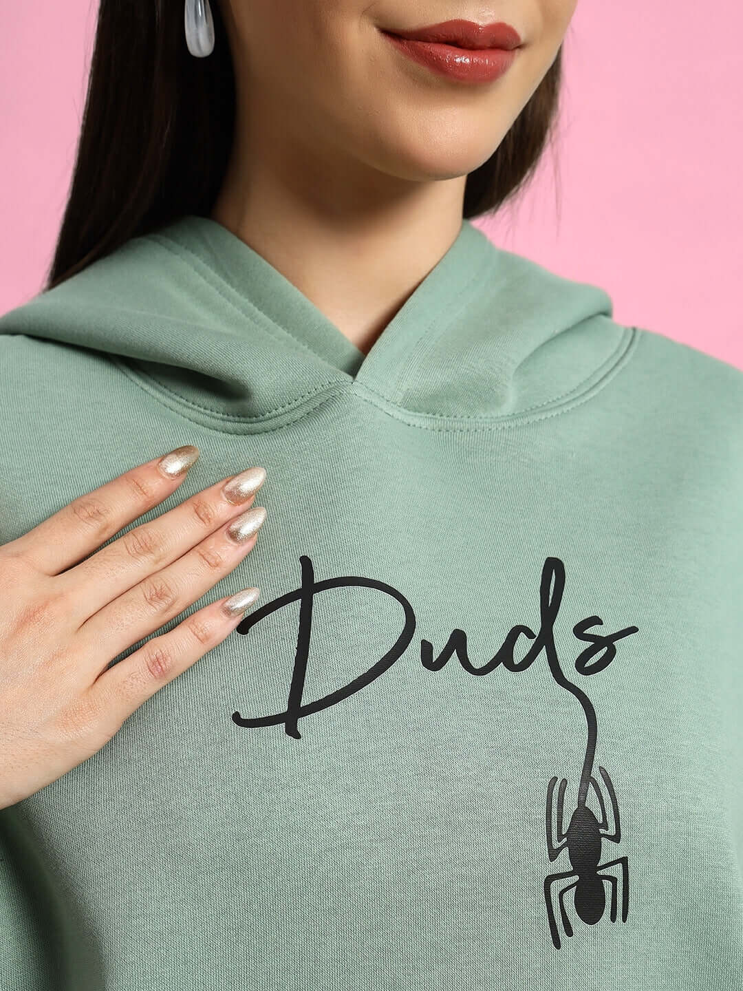 Close-up of WOMEN SPIDERMAN OVERSIZED FLEECE HOODIE JADE GREEN showcasing design details.