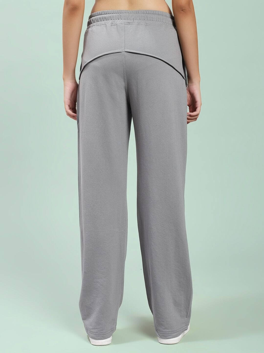 Back view of WOMEN SPIRAL RELAXED-FIT JOGGERS GREY showcasing laid-back silhouette and comfort.