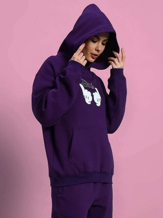 Model wearing WOMEN SUPREME FLEECE HOODIE PURPLE, showcasing chic streetwear style in premium fleece fabric, perfect for cozy comfort.