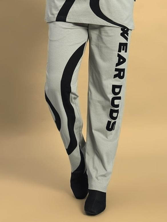 Women's grey surfing jogger pants with black side graphics and "WEAR DUDS" print, made to order by DUDS tailors.
