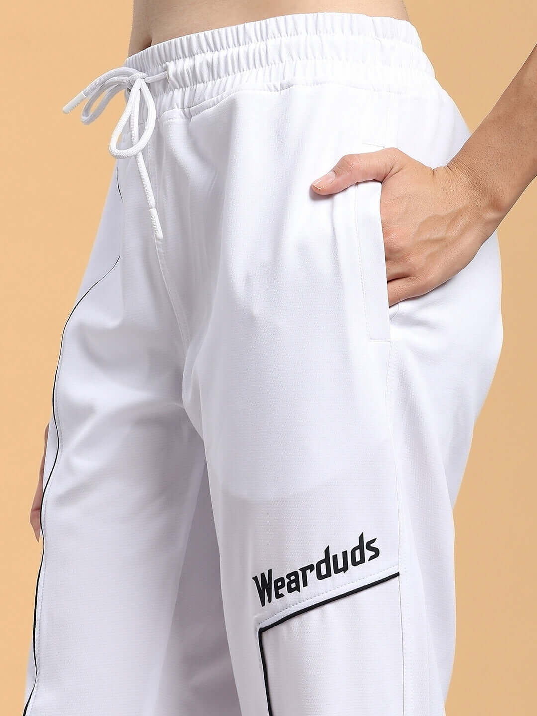 WOMENS TOKYO RELAXED FIT JOGGERS WHITE with a drawstring waist, shown on a model, highlighting the soft texture and comfortable fit.