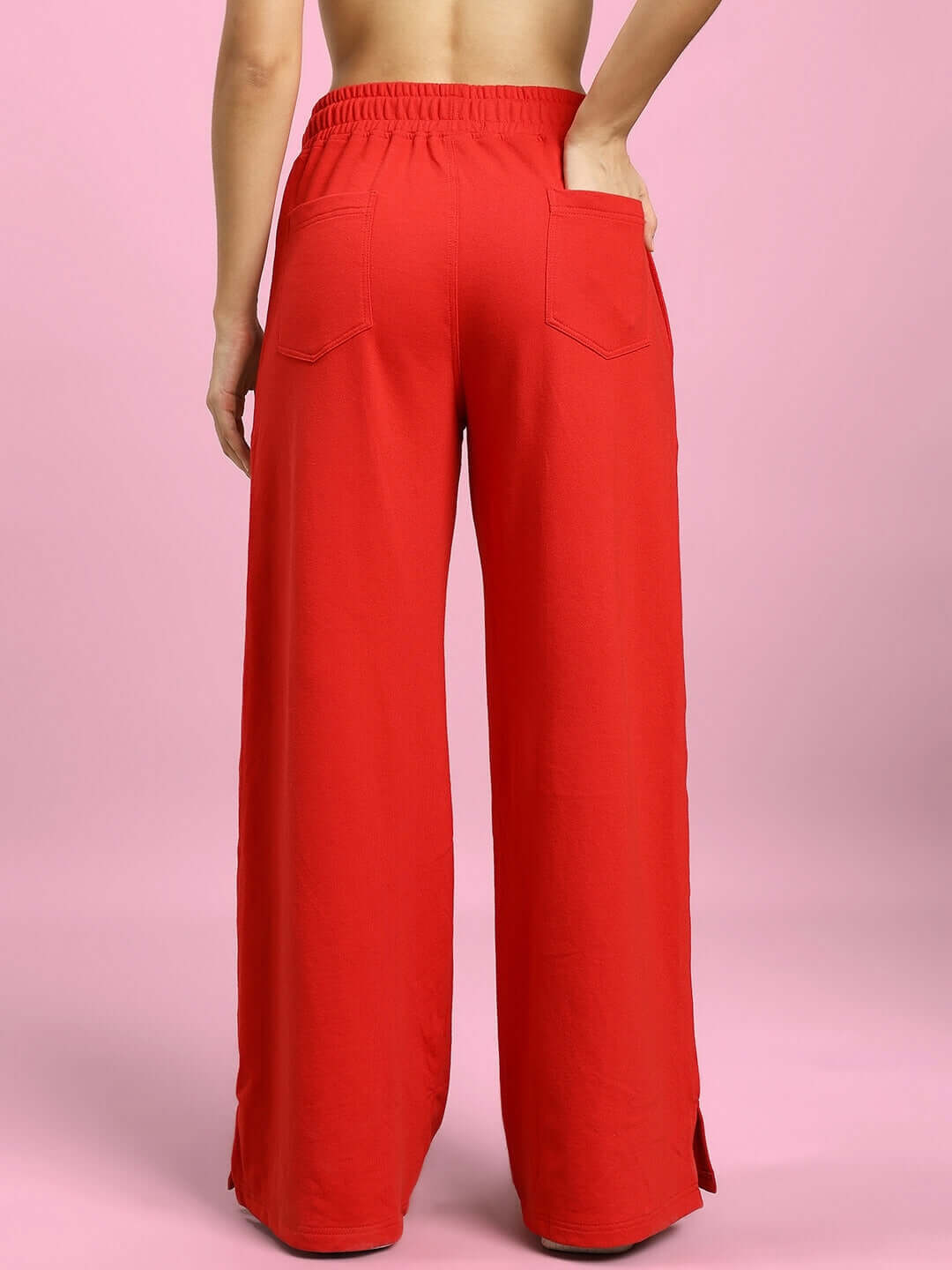 Back view of Women's United Stripe Joggers in red, showcasing elastic waistband and pockets, tailored by DUDS for custom fit.