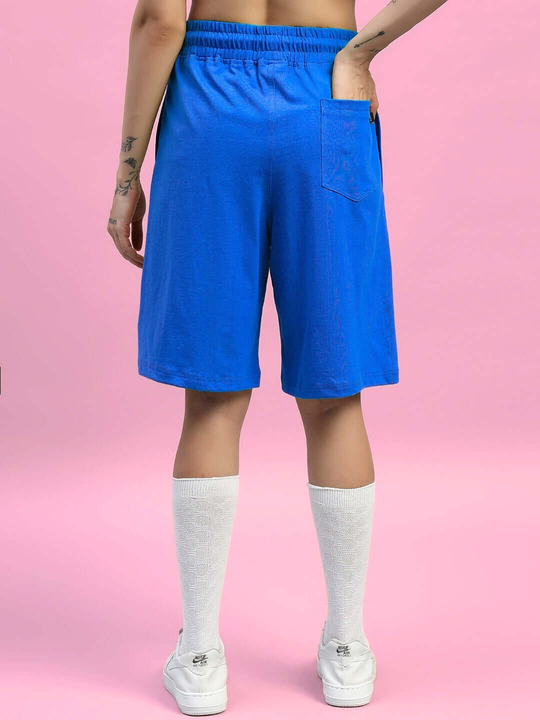 Back view of WOMENS WIDELINE SUMMER CO-ORD SET BLUE showing blue shorts with white socks.