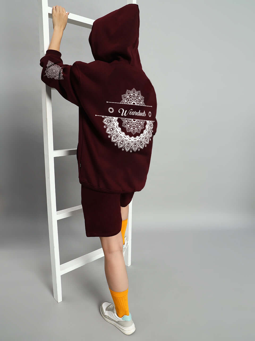 Model wearing WOMEN'S YANTRA FLEECE CO-ORD SET WINE, showcasing back design, displaying cozy and stylish fleece outfit for casual wear.