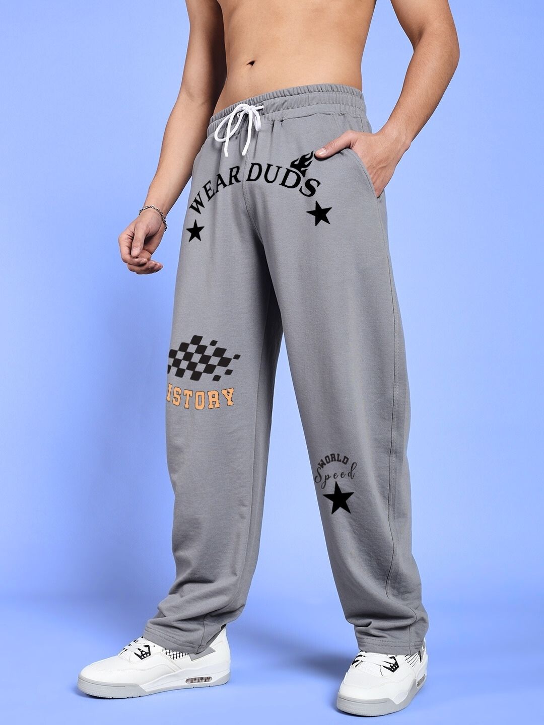 Man wearing WORLD SPEED PRINTED RELAXED FIT JOGGERS GREY featuring graphic designs, comfortable and stylish for casual wear.