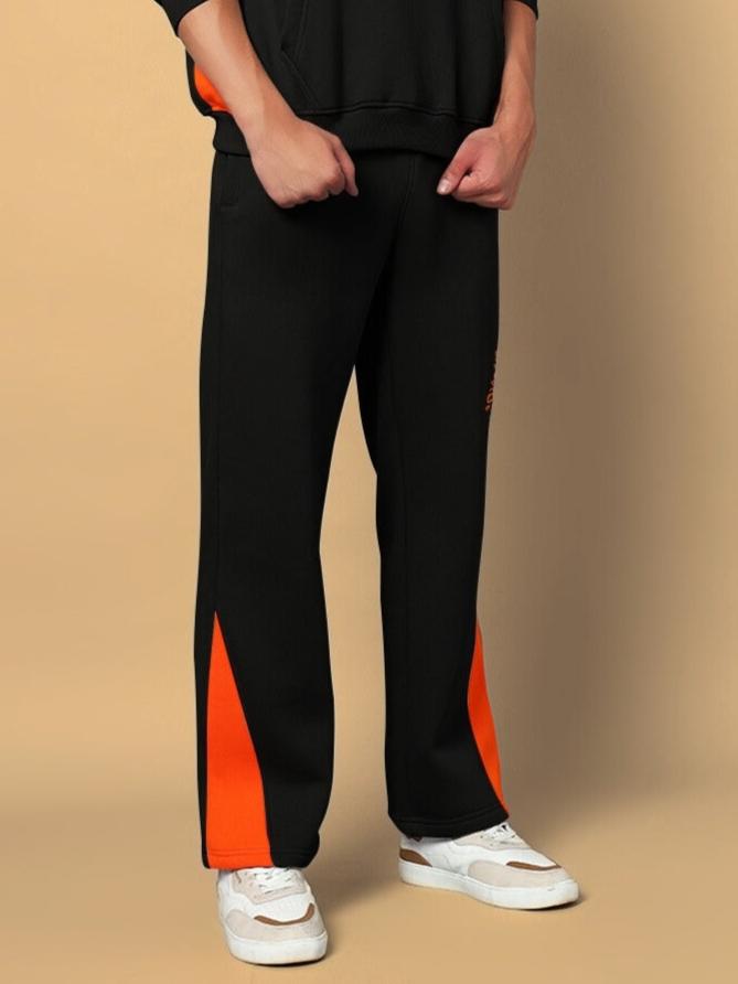 Men's WorldWide black fleece joggers with orange accents, comfortable fit, made to order by DUDS.