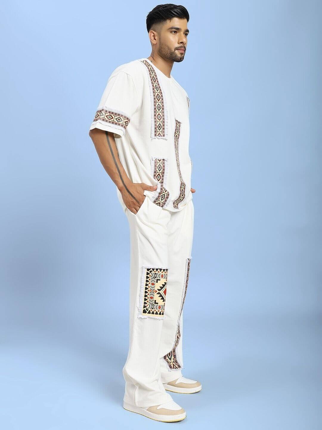 YARA GEOMETRIC PRINT CO-ORD SET OFF-WHITE stylish two-piece with chic geometric print against blue background.