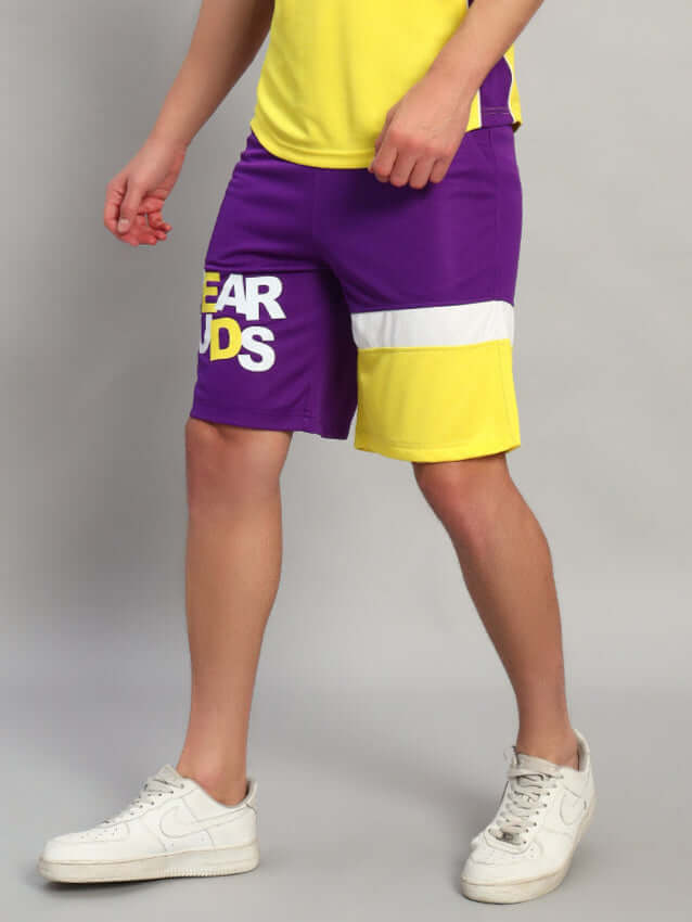 ZENITH REGULAR FIT SHORTS PURPLE YELLOW worn by model in sporty outfit