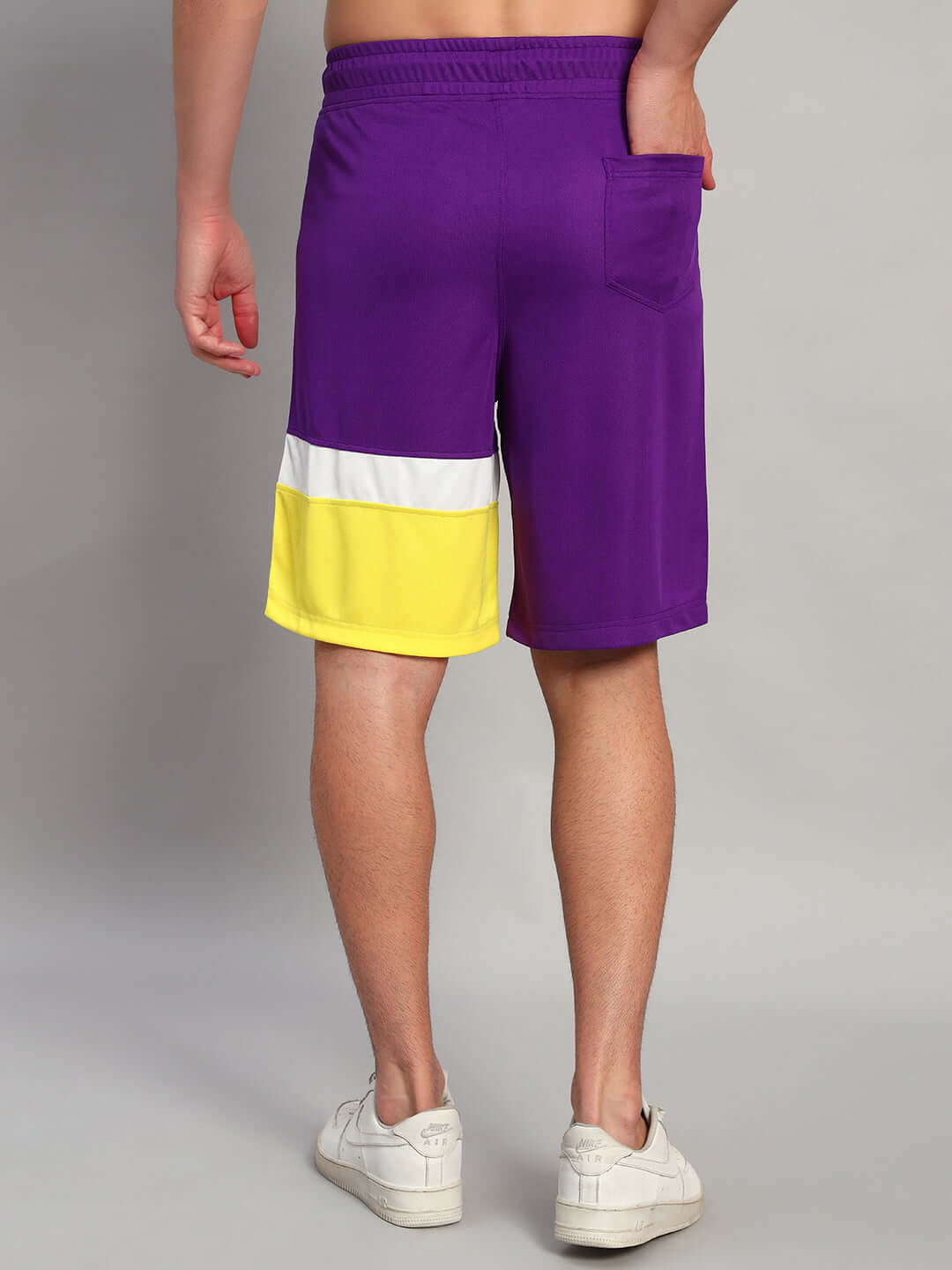 Back view of ZENITH REGULAR FIT SHORTS PURPLE YELLOW showing vibrant color and comfortable design.
