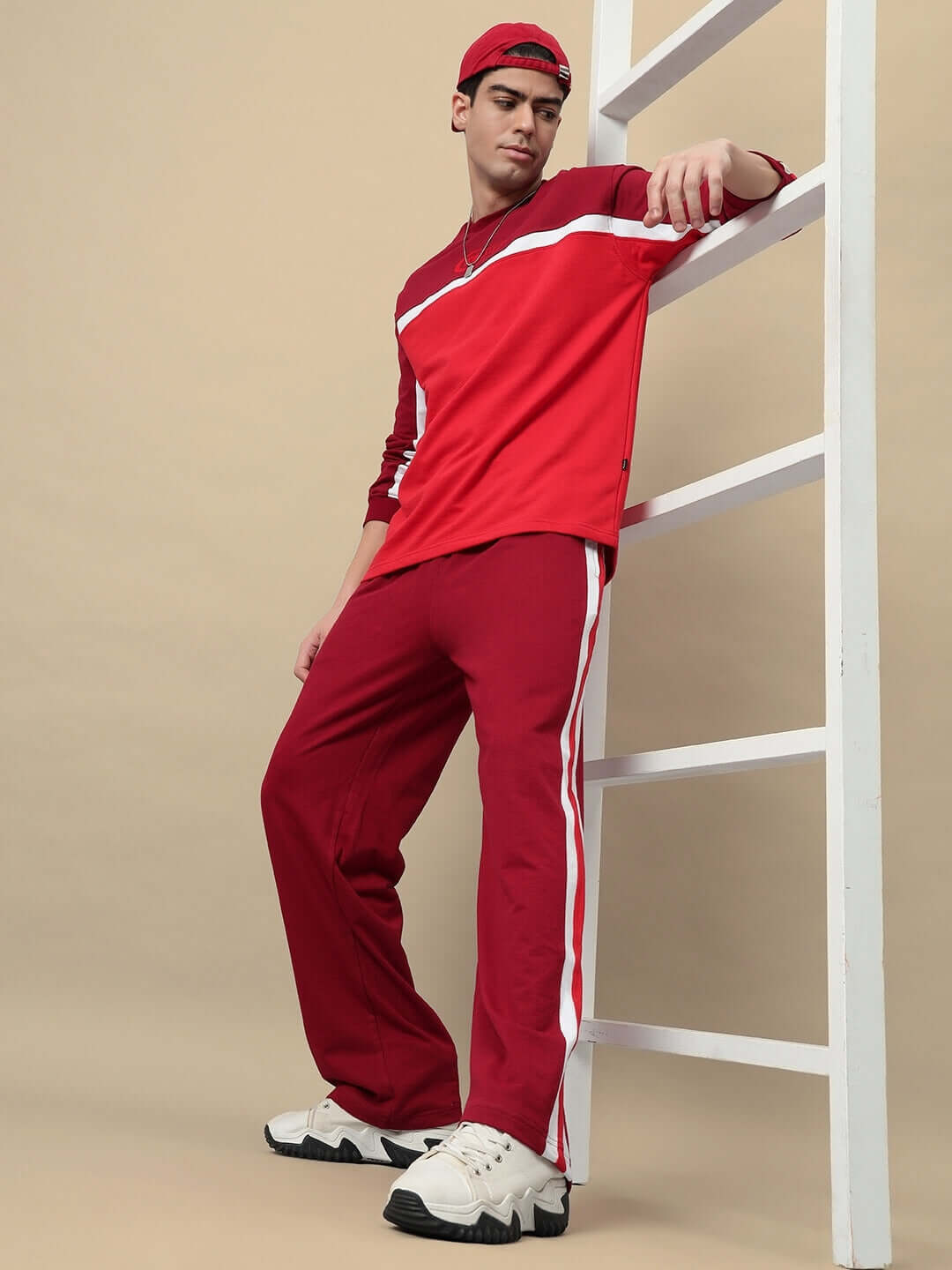 Man modeling ZEST OVERSIZED CO-ORD SET MAROON with oversized sweatshirt and joggers, perfect for streetwear.