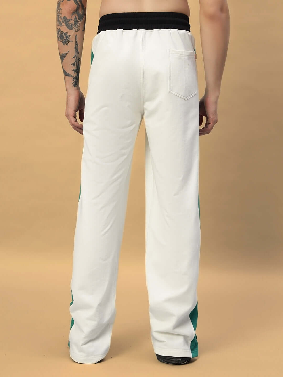 Back view of Zingy Jogger in off white and teal, featuring a relaxed fit and made-to-order customization option by DUDS.
