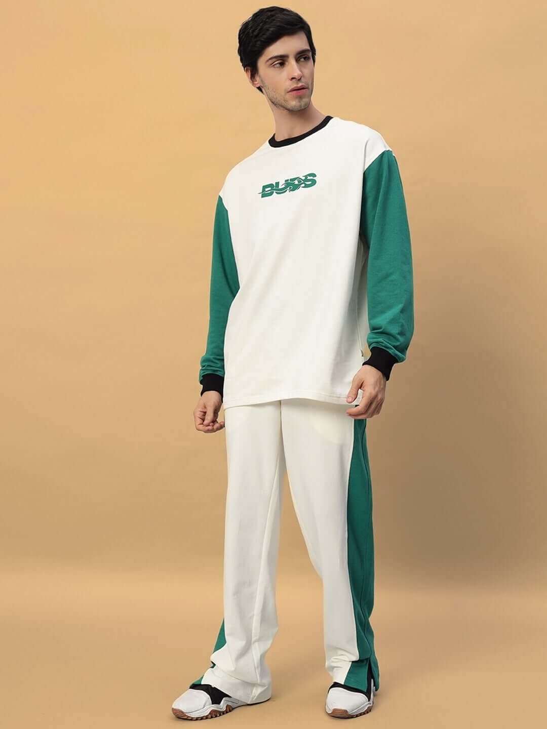Man wearing ZINGY JOGGER in off-white and teal by DUDS, featuring long sleeves and custom fit option available for orders.
