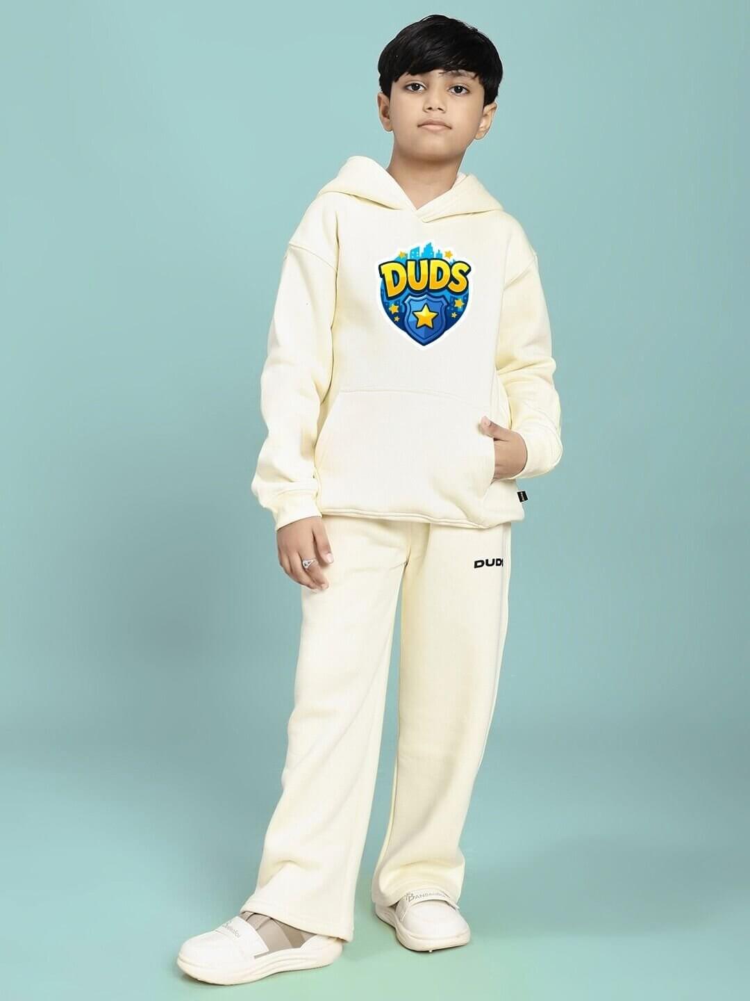 Child wearing ZOOTOPIA WORLD FLEECE CO-ORD FOR BOYS AND GIRLS OFF WHITE with graphic hoodie and matching pants.