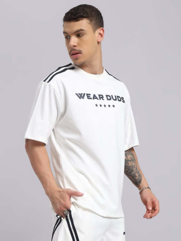 Model wearing STAR JUMPER OVER-SIZED T-SHIRT OFF WHITE made from premium heavy gauge fabric