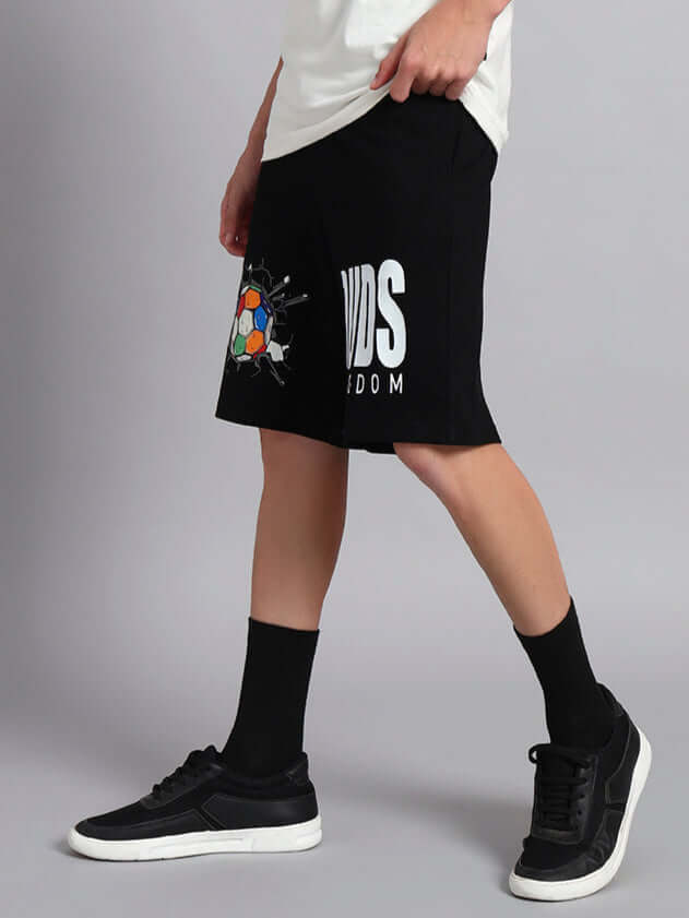 Person wearing LAZIO Summer Shorts in black with DUDS Freedom logo, showcasing casual style and comfort.
