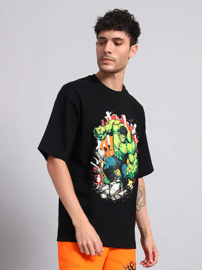 Model wearing black Hulk over-sized t-shirt with graphic design, perfect for trendy summer look, lightweight cotton material.