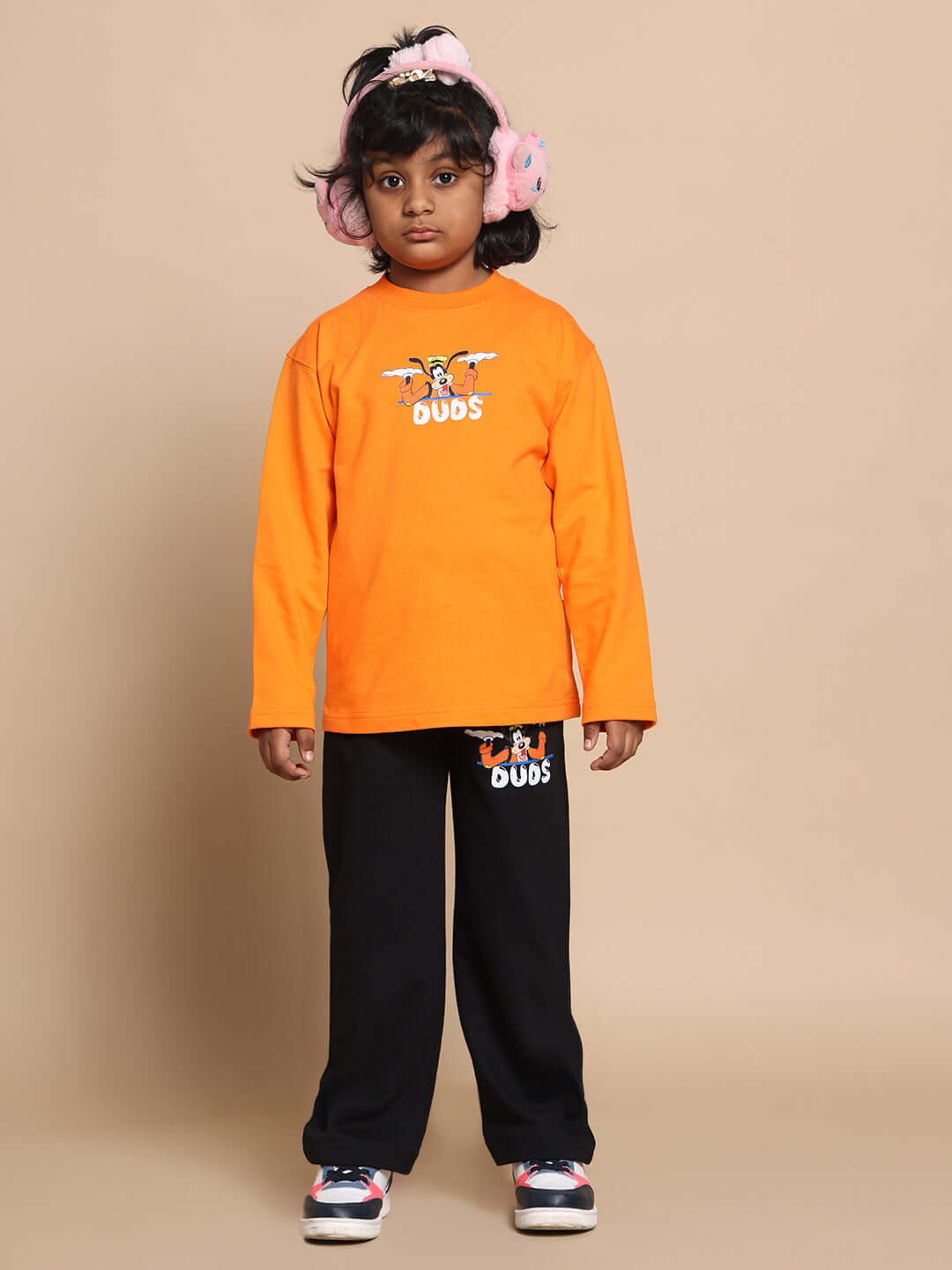 Child wearing orange and black Goofy co-ord set, featuring a relaxed fit with elasticated waistband, suitable for boys and girls.