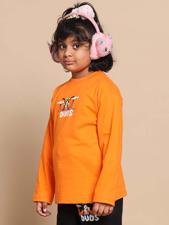 Child wearing orange top from Goofy Co-ord Set with cartoon print.