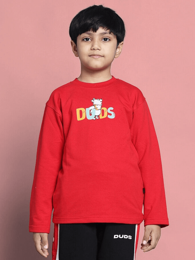 Child wearing Winnie Oversized Sweatshirt in red for boys and girls by DUDS, showcasing comfortable fashion.