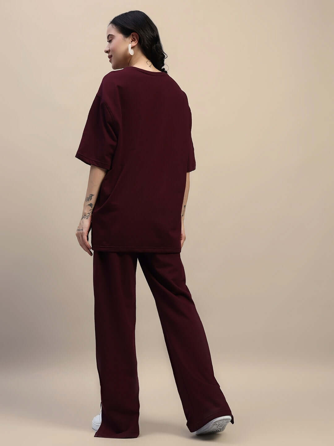 Women's maroon relaxed fit co-ord set with joggers and t-shirt, made from premium cotton and elastane, showcasing back view.