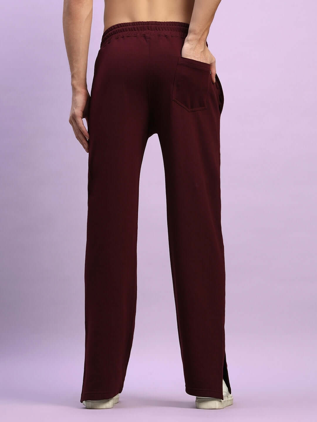 Rear view of maroon Zion side slit joggers from DUDS, featuring a pocket and elastic waistband, perfect for custom fit orders.