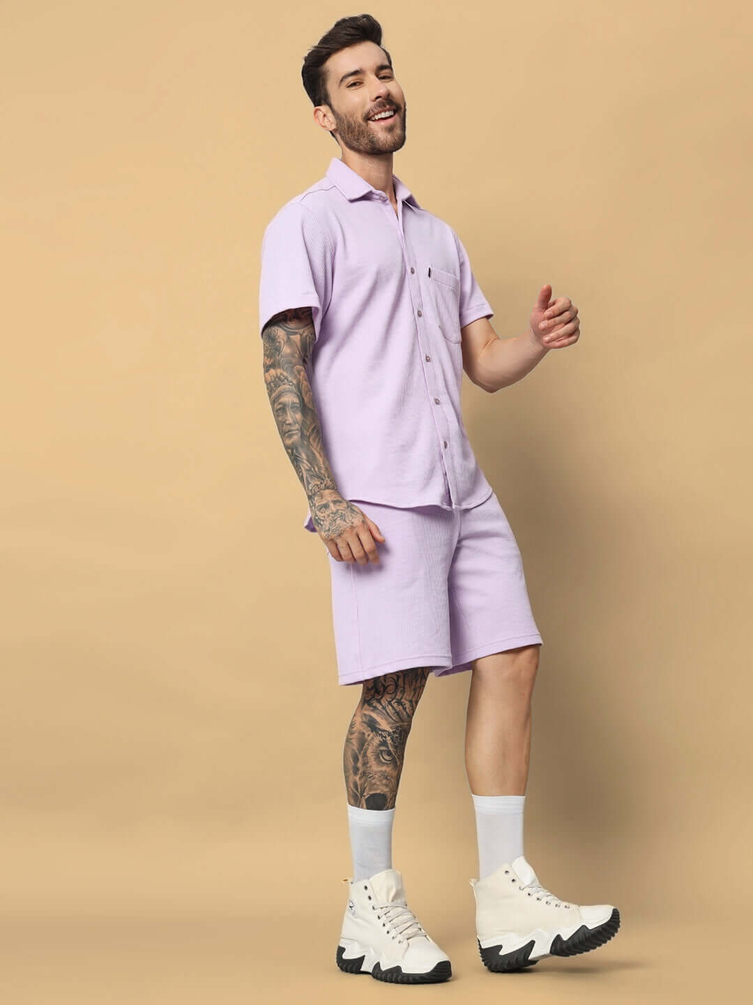 Man wearing MERCY solid co-ord set in lilac, made of waffle fabric, 100% cotton, relaxed fit, ideal for casual summer wear, showcased on model.