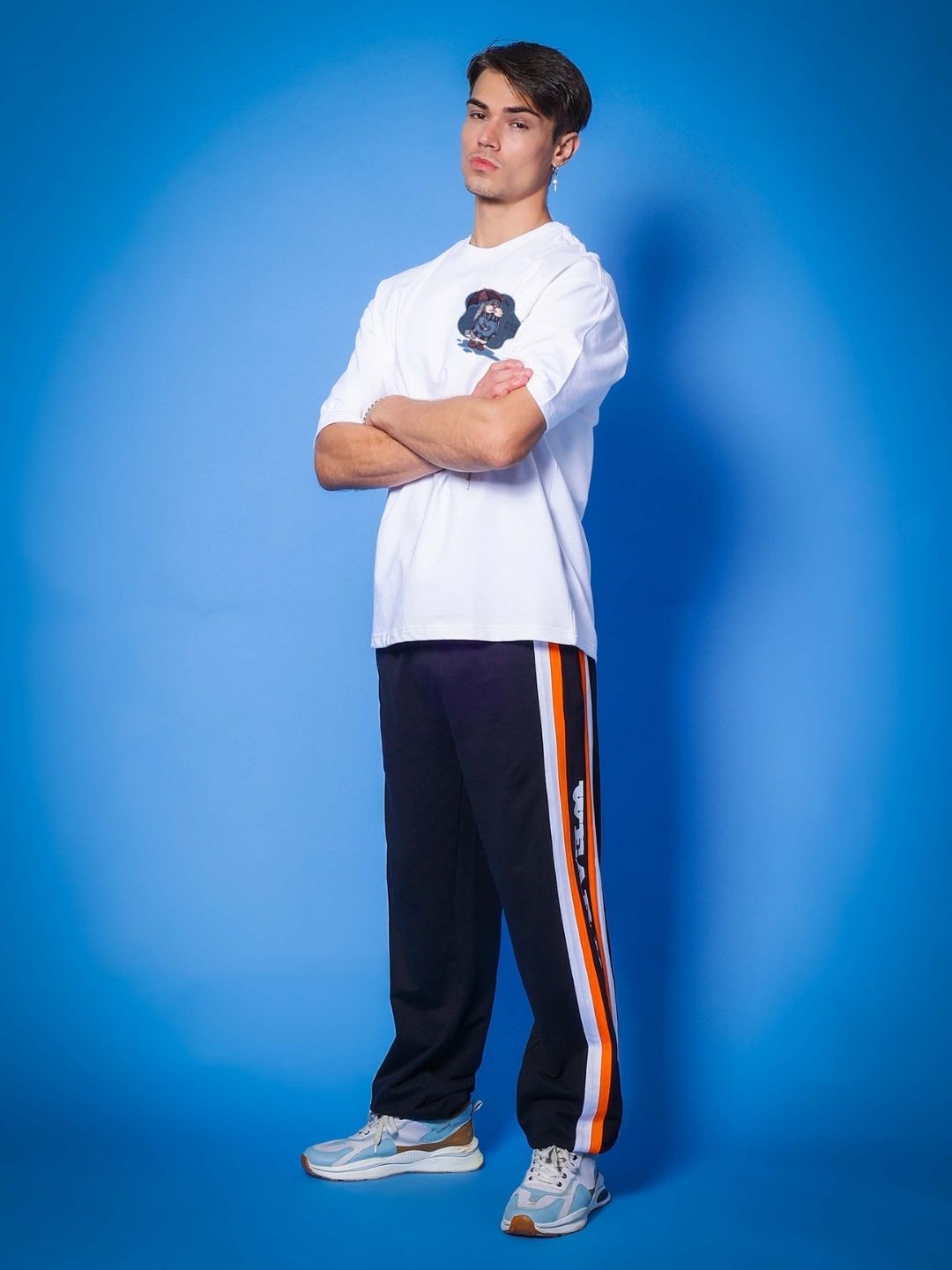 Model wearing BLUE LAPIN OVER-SIZED T-SHIRT WHITE made with premium heavy gauge fabric, featuring 97% premium cotton and 3% elastane.