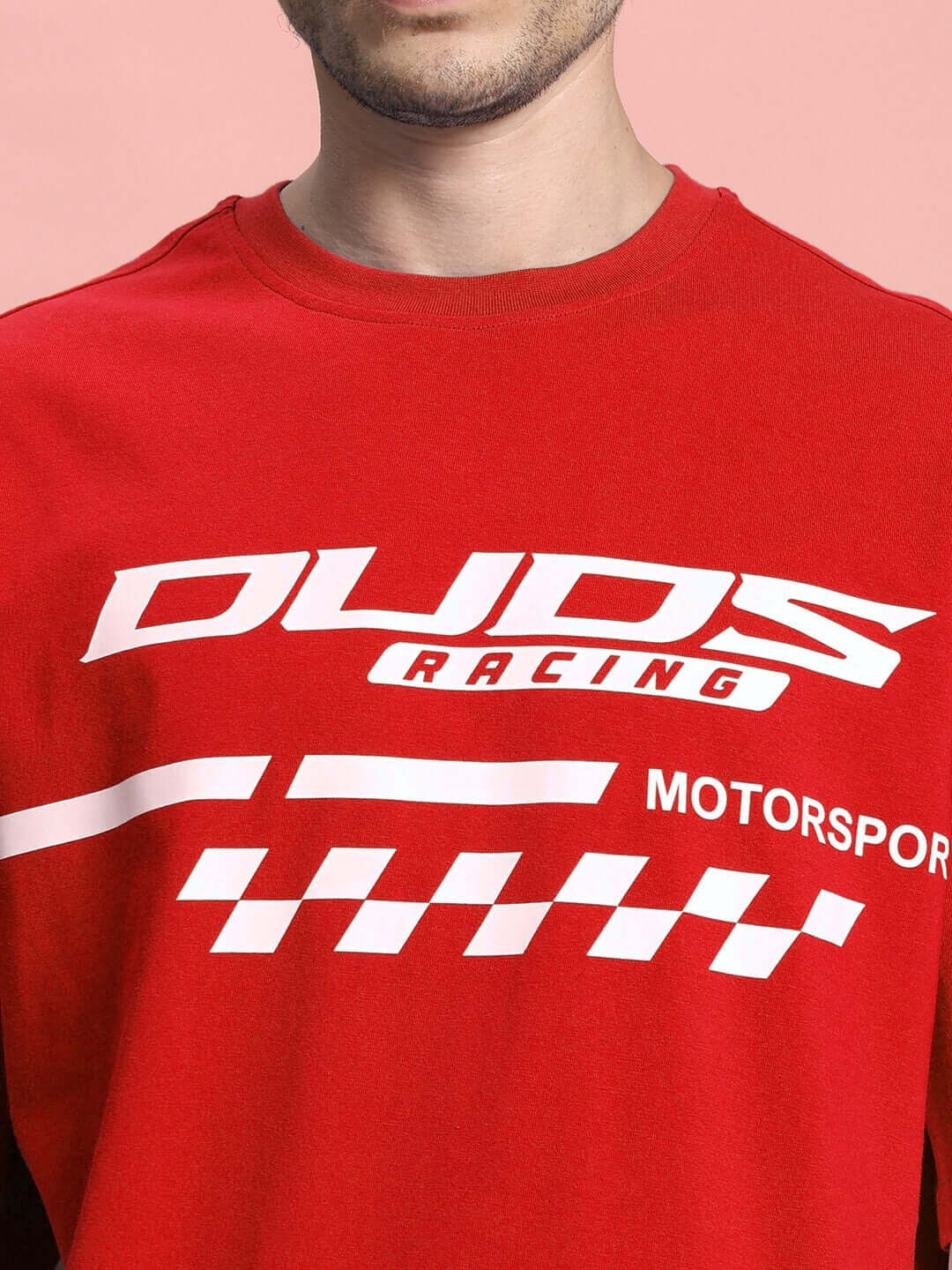Close-up of INDY over-sized classic red T-shirt featuring bold racing graphics, made from premium cotton French terry.