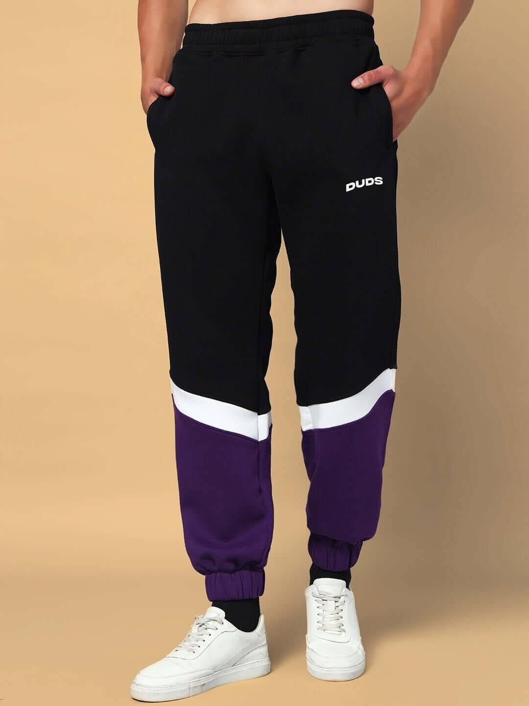 Harley Fleece Colorblock Jogger in purple and black with white accents by Duds, featuring elastic cuffs and waistband for a comfortable fit.